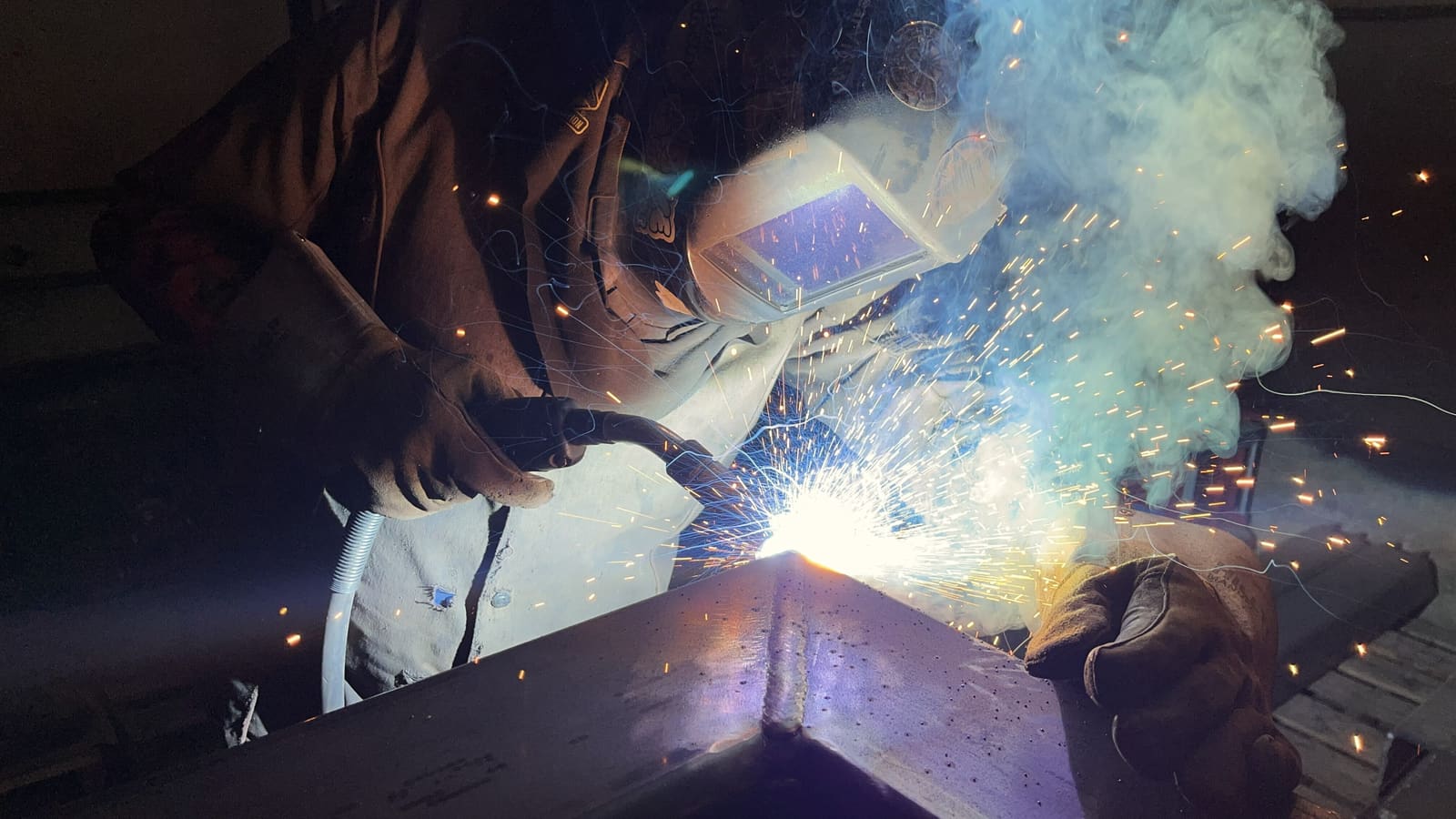 Boulder Metal welder at work on a structural beam